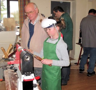 Geoff giving tutition to one of the girls, this time making a mushroom